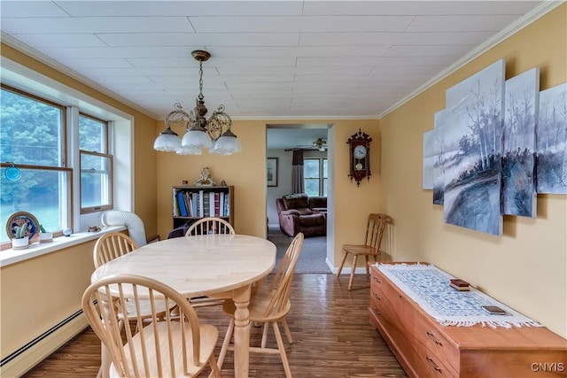 32227 County Route 22, Antwerp, NY 13691 - dining space featuring baseboard heating, plenty of natural light, dark wood-type flooring, a chandelier, and ornamental molding