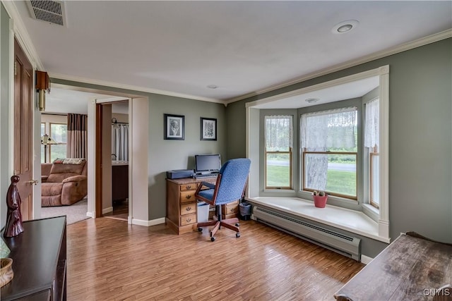 32227 County Route 22, Antwerp, NY 13691 - home office featuring a baseboard heating unit, ornamental molding, and wood finished floors