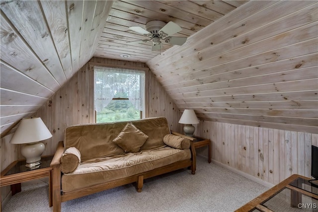 32227 County Route 22, Antwerp, NY 13691 - living area featuring wood walls, vaulted ceiling, wood ceiling, carpet floors, and a ceiling fan