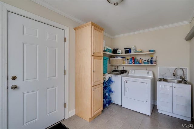 28005/08 Stony Point Rd, Cape Vincent, NY 13618 - laundry room featuring washer and clothes dryer, ornamental molding, cabinet space, and light tile patterned floors