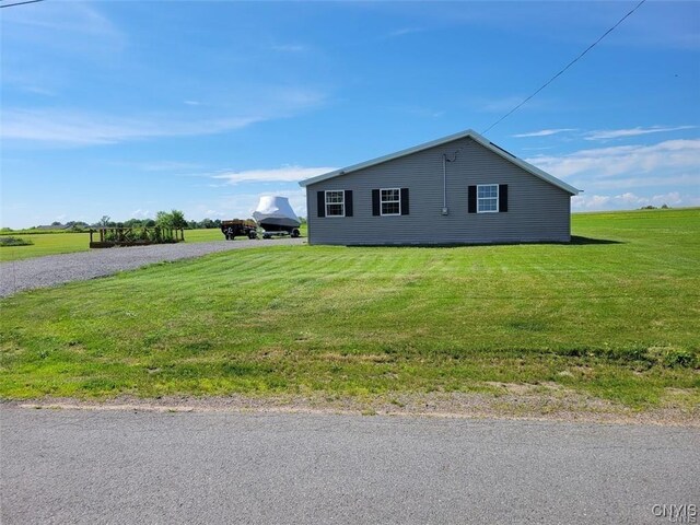 28005/08 Stony Point Rd, Cape Vincent, NY 13618 - view of side of property featuring a lawn and gravel driveway