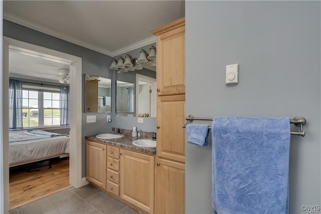 28005/08 Stony Point Rd, Cape Vincent, NY 13618 - ensuite bathroom with double vanity, crown molding, a ceiling fan, and tile patterned flooring