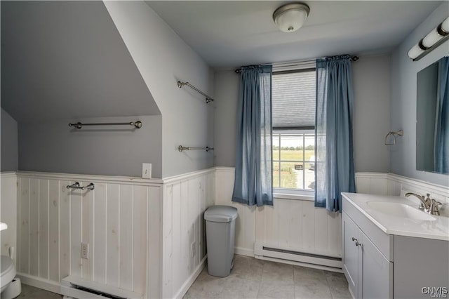 28005/08 Stony Point Rd, Cape Vincent, NY 13618 - bathroom with a baseboard heating unit, vanity, and a wainscoted wall