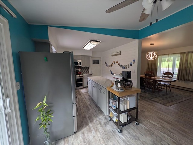 1525 S Ave, Lewis Run, PA 16738 - kitchen featuring appliances with stainless steel finishes, light wood-type flooring, ceiling fan, light countertops, and a chandelier