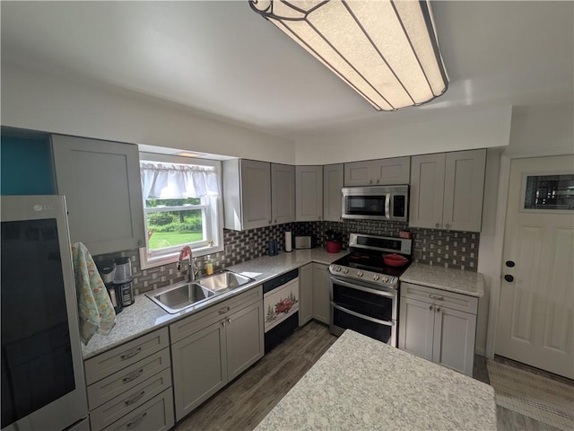 1525 S Ave, Lewis Run, PA 16738 - kitchen featuring appliances with stainless steel finishes, tasteful backsplash, gray cabinets, and light countertops