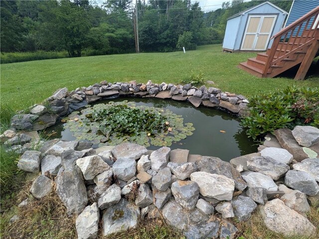 1525 S Ave, Lewis Run, PA 16738 - view of grassy yard with a garden pond and a storage shed