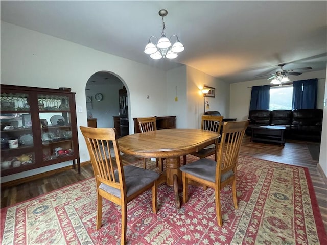 458 County Road 16, Plymouth, NY 13832 - dining room featuring arched walkways, wood finished floors, ceiling fan, and a chandelier