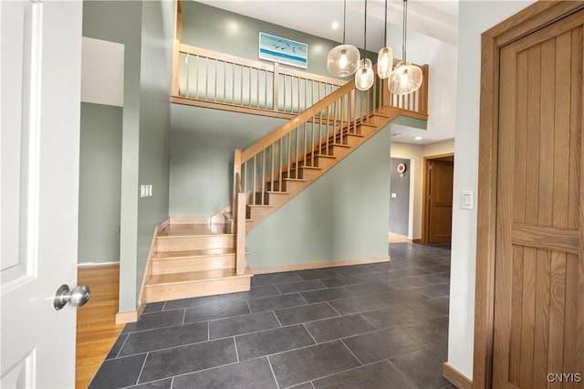 3313 Thompson Rd, Cazenovia, NY 13035 - stairs with a high ceiling, tile patterned floors, recessed lighting, and a chandelier