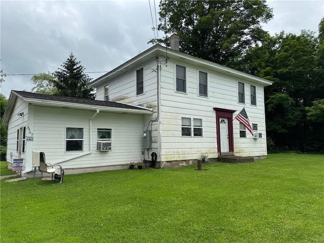 6463 County Road 20, Friendship, NY 14739 - back of house featuring a lawn, cooling unit, and a chimney
