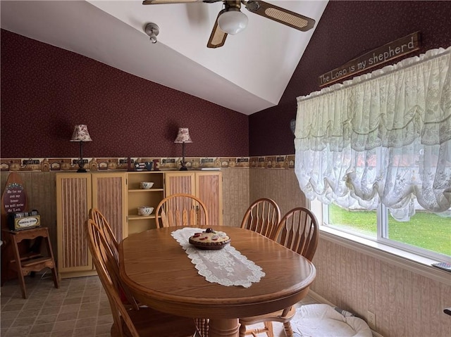6463 County Road 20, Friendship, NY 14739 - dining area featuring wallpapered walls, a ceiling fan, a wainscoted wall, and vaulted ceiling