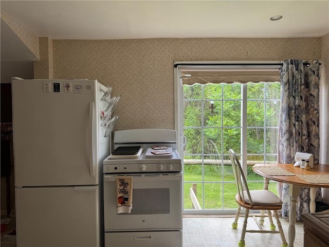 6463 County Road 20, Friendship, NY 14739 - kitchen with white appliances and wallpapered walls