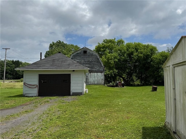 6463 County Road 20, Friendship, NY 14739 - view of grassy yard featuring an outdoor structure and a garage