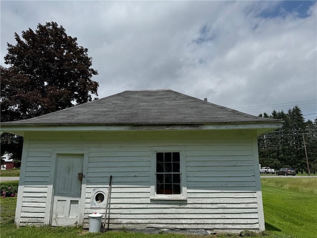 6463 County Road 20, Friendship, NY 14739 - rear view of property with a shingled roof and a lawn