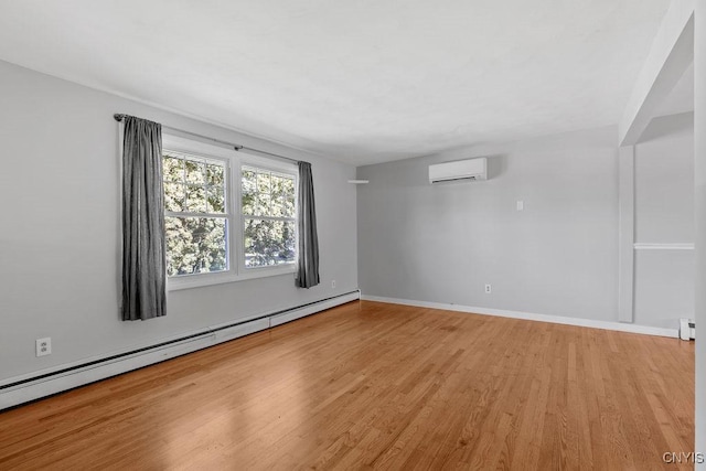 113 Craig Cir, Dewitt, NY 13214 - spare room featuring a wall mounted air conditioner, a baseboard heating unit, and light wood finished floors