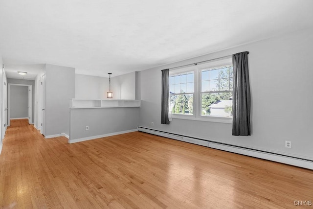 113 Craig Cir, Dewitt, NY 13214 - unfurnished room featuring baseboard heating and light wood-style flooring