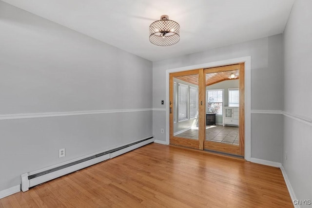 113 Craig Cir, Dewitt, NY 13214 - spare room featuring a baseboard radiator and light wood-style flooring