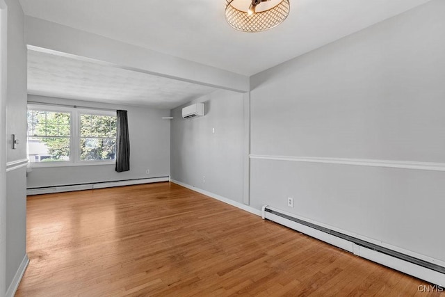 113 Craig Cir, Dewitt, NY 13214 - empty room featuring baseboard heating, an AC wall unit, and wood finished floors