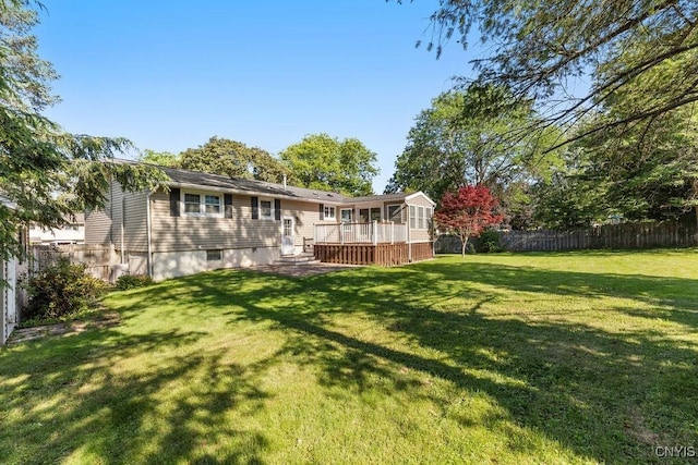 113 Craig Cir, Dewitt, NY 13214 - fenced backyard featuring a sunroom and a wooden deck