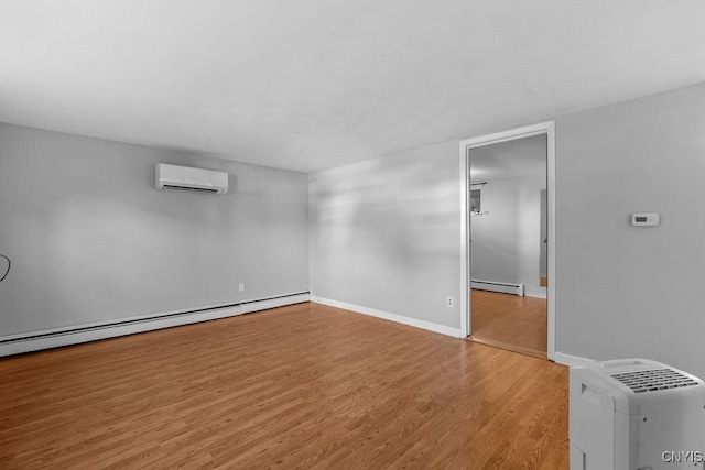 113 Craig Cir, Dewitt, NY 13214 - unfurnished room with a wall mounted air conditioner, a baseboard heating unit, and wood finished floors