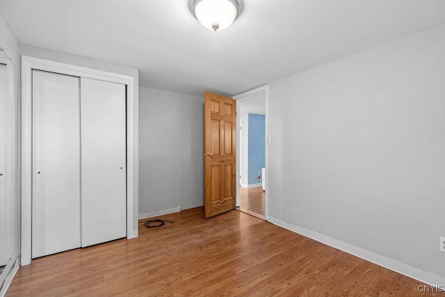 113 Craig Cir, Dewitt, NY 13214 - unfurnished bedroom with light wood-style flooring and a closet