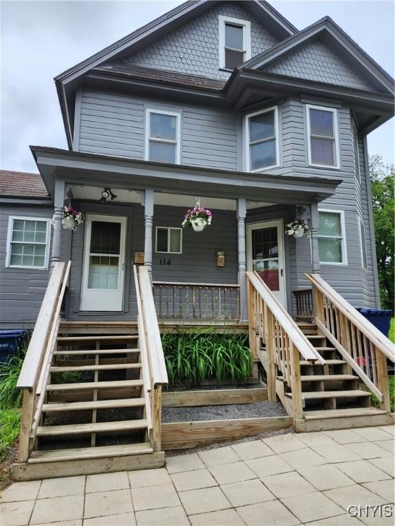 114 Stevens Pl, Syracuse, NY 13210 - view of front facade featuring stairs and covered porch