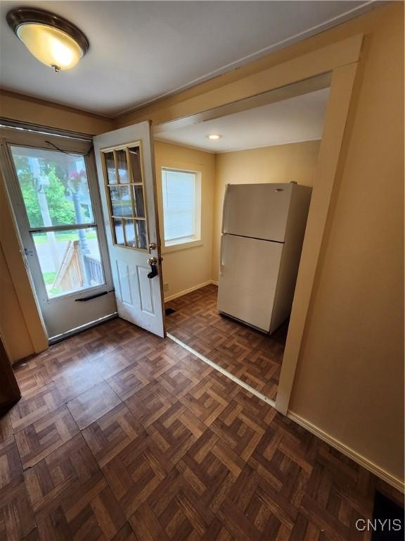 114 Stevens Pl, Syracuse, NY 13210 - doorway to outside featuring baseboards