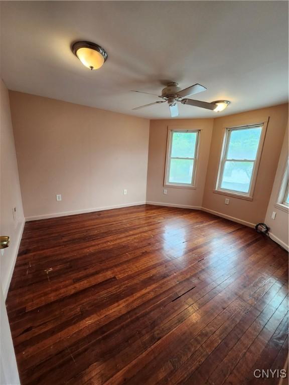 114 Stevens Pl, Syracuse, NY 13210 - unfurnished room featuring dark wood-type flooring and a ceiling fan