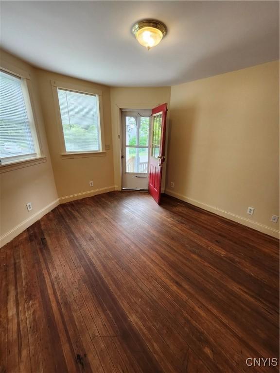 114 Stevens Pl, Syracuse, NY 13210 - empty room with dark wood-style floors and baseboards