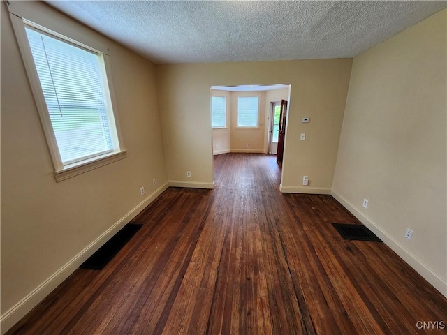 114 Stevens Pl, Syracuse, NY 13210 - empty room featuring dark wood finished floors and a textured ceiling
