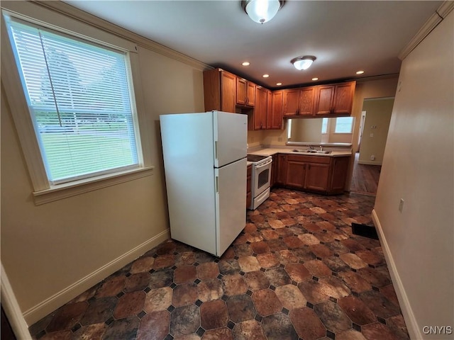 114 Stevens Pl, Syracuse, NY 13210 - kitchen with white appliances, ornamental molding, light countertops, recessed lighting, and brown cabinets