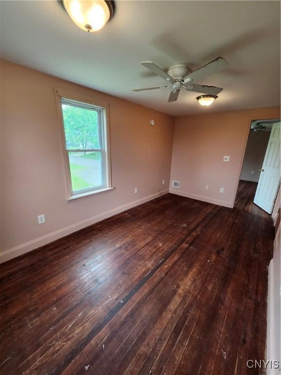 114 Stevens Pl, Syracuse, NY 13210 - unfurnished room with dark wood-type flooring and ceiling fan
