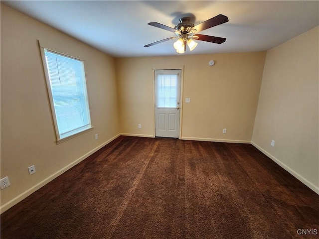 114 Stevens Pl, Syracuse, NY 13210 - empty room featuring a ceiling fan and dark carpet