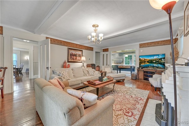 6188 Lake St, Aurelius, NY 13034 - living room featuring a chandelier, wood finished floors, healthy amount of natural light, and beam ceiling