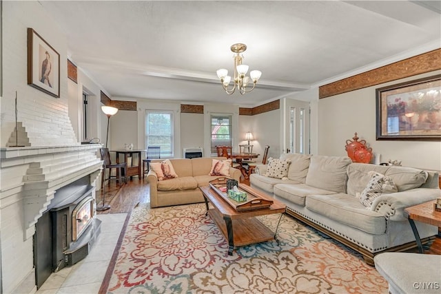 6188 Lake St, Aurelius, NY 13034 - living room with a chandelier, a wood stove, and crown molding