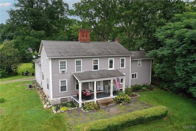 6188 Lake St, Aurelius, NY 13034 - rear view of house featuring a chimney, a lawn, and a shingled roof
