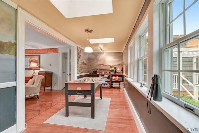 6188 Lake St, Aurelius, NY 13034 - playroom featuring a skylight and light wood-style flooring
