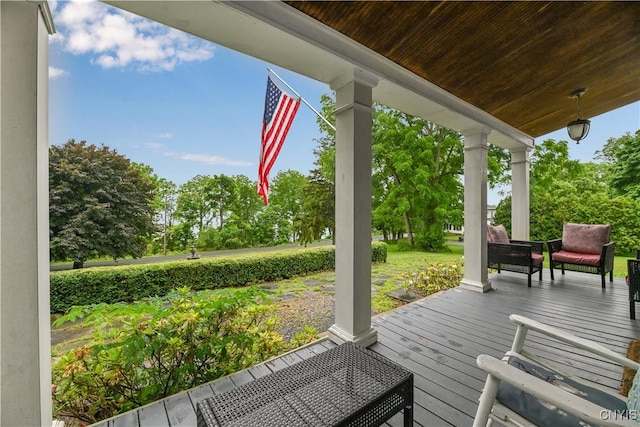 6188 Lake St, Aurelius, NY 13034 - wooden porch with view of wooded area