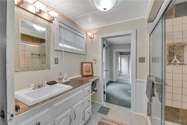 6188 Lake St, Aurelius, NY 13034 - bathroom with vanity, a stall shower, tile patterned floors, and crown molding