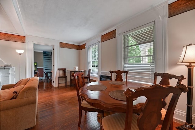 6188 Lake St, Aurelius, NY 13034 - dining area featuring wood finished floors and ornamental molding