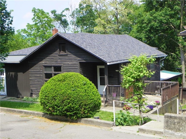 202-204-206 N Monroe St, Reading, NY 14891 - view of front facade featuring a shingled roof and a chimney