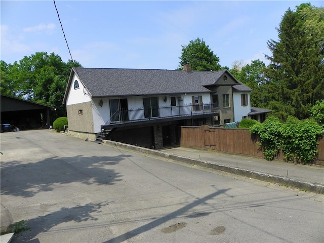 202-204-206 N Monroe St, Reading, NY 14891 - view of front of property featuring stairs, stucco siding, a chimney, and a shingled roof