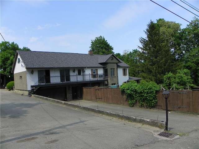 202-204-206 N Monroe St, Reading, NY 14891 - view of front facade featuring stucco siding, a chimney, and roof with shingles