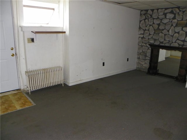 202-204-206 N Monroe St, Reading, NY 14891 - unfurnished living room featuring radiator and a fireplace