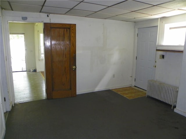202-204-206 N Monroe St, Reading, NY 14891 - empty room with radiator and a paneled ceiling