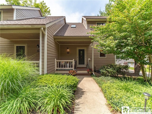 29 Elm Ln Unit 24, Chautauqua, NY 14722 - view of front of home featuring roof with shingles and a porch