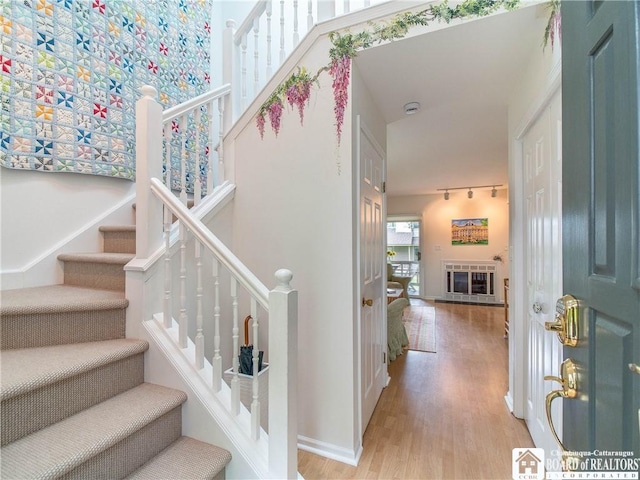 29 Elm Ln Unit 24, Chautauqua, NY 14722 - stairway featuring wood finished floors and rail lighting