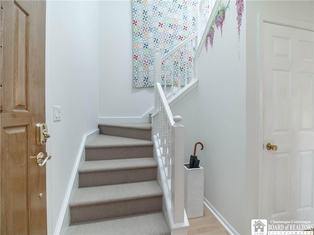 29 Elm Ln Unit 24, Chautauqua, NY 14722 - staircase with baseboards and wood finished floors