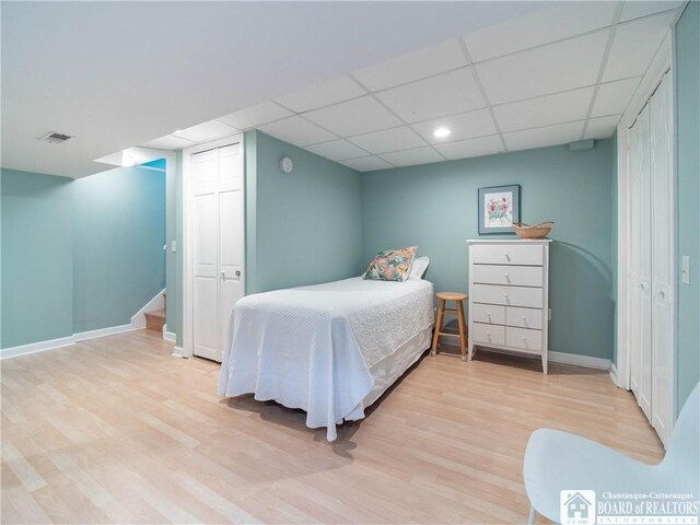 29 Elm Ln Unit 24, Chautauqua, NY 14722 - bedroom with wood finished floors, a paneled ceiling, a closet, and recessed lighting