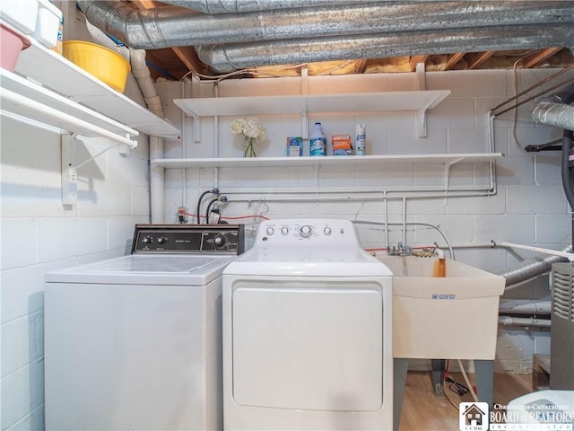 29 Elm Ln Unit 24, Chautauqua, NY 14722 - washroom with independent washer and dryer, concrete block wall, and wood finished floors