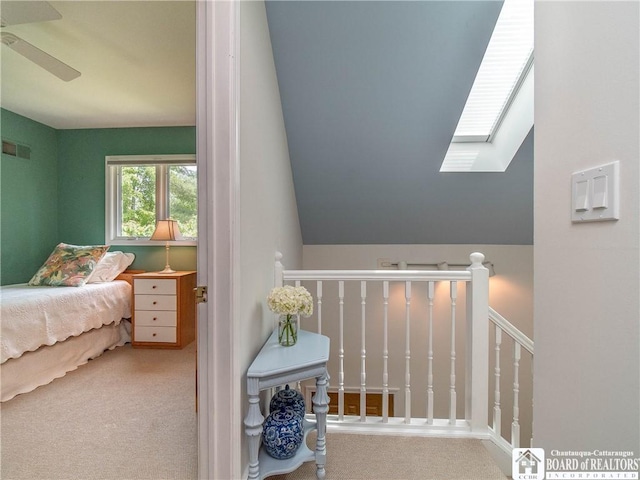 29 Elm Ln Unit 24, Chautauqua, NY 14722 - carpeted bedroom featuring a skylight, lofted ceiling, and a ceiling fan